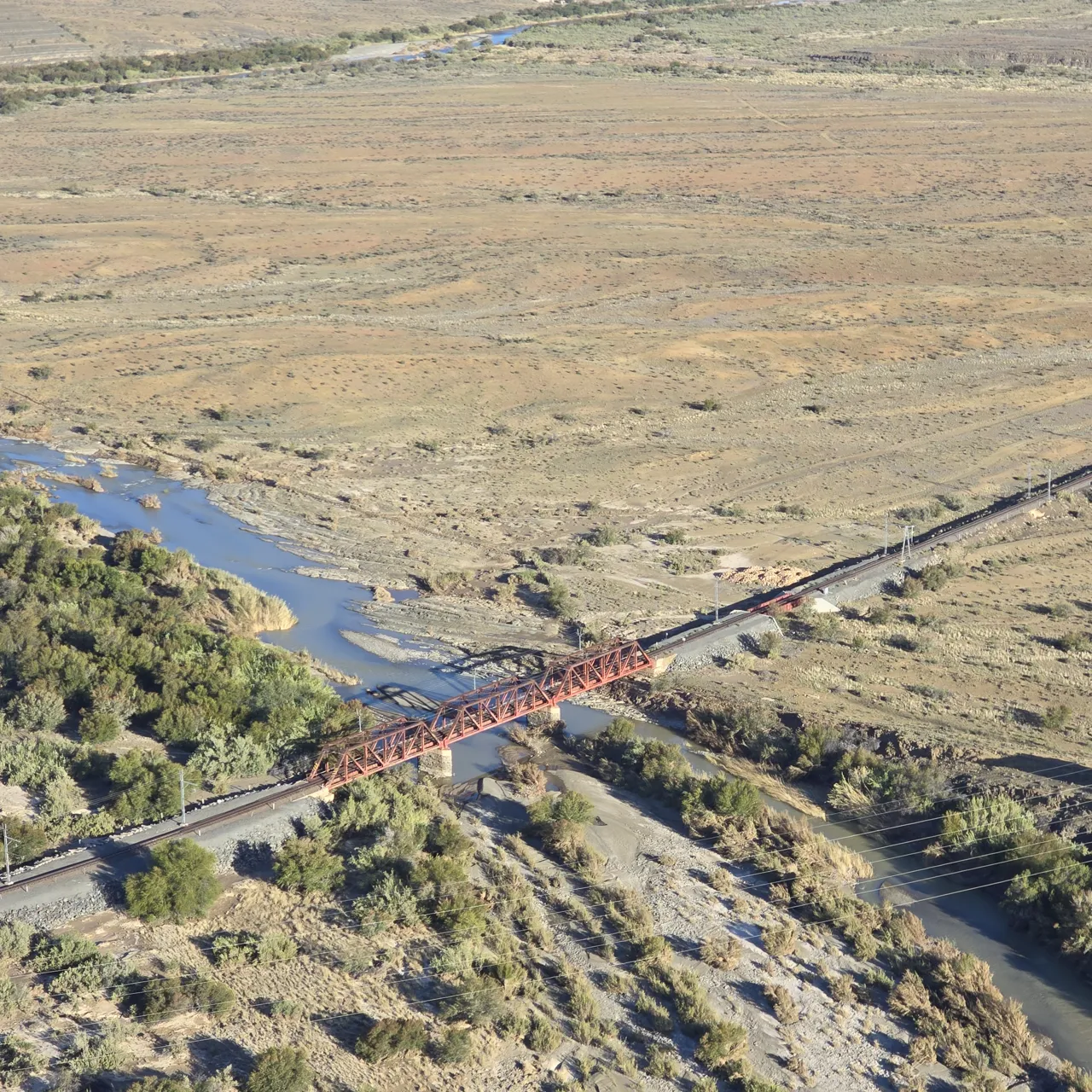 A railway bridge over a river bed in the Karoo seen from the paramotor on Day 3